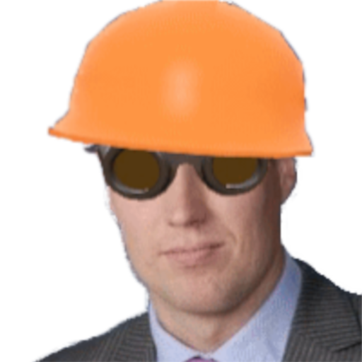 A man in a suit wearing welding goggles and an orange hard hat
